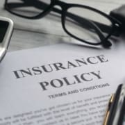 insurance-policy-and-calculator-on-desktop-surface-2026-09-21-13-16-06-utc